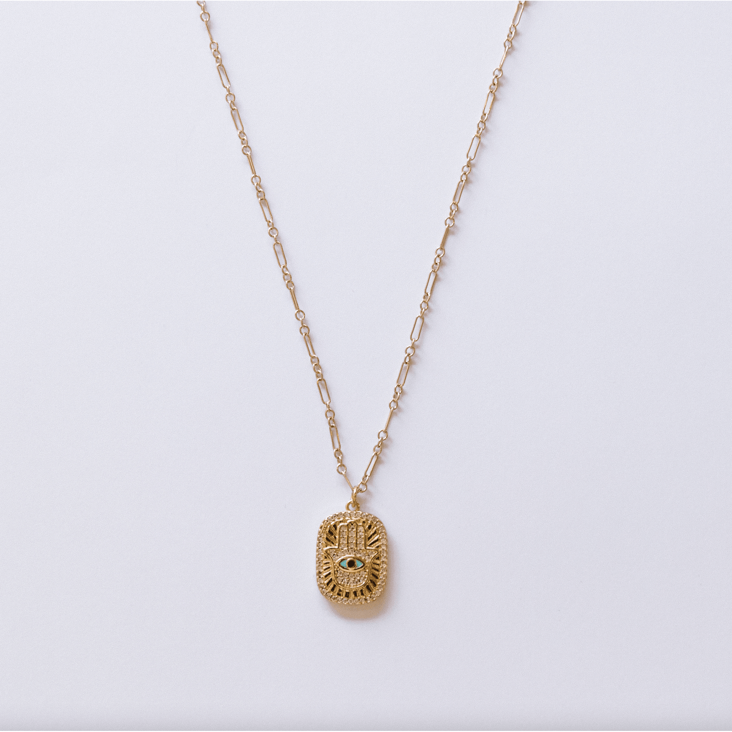 Hamsa Evil Eye Tag Necklace gold-filled chain with double-sided turquoise and gold charm featuring CZ stone embellishment