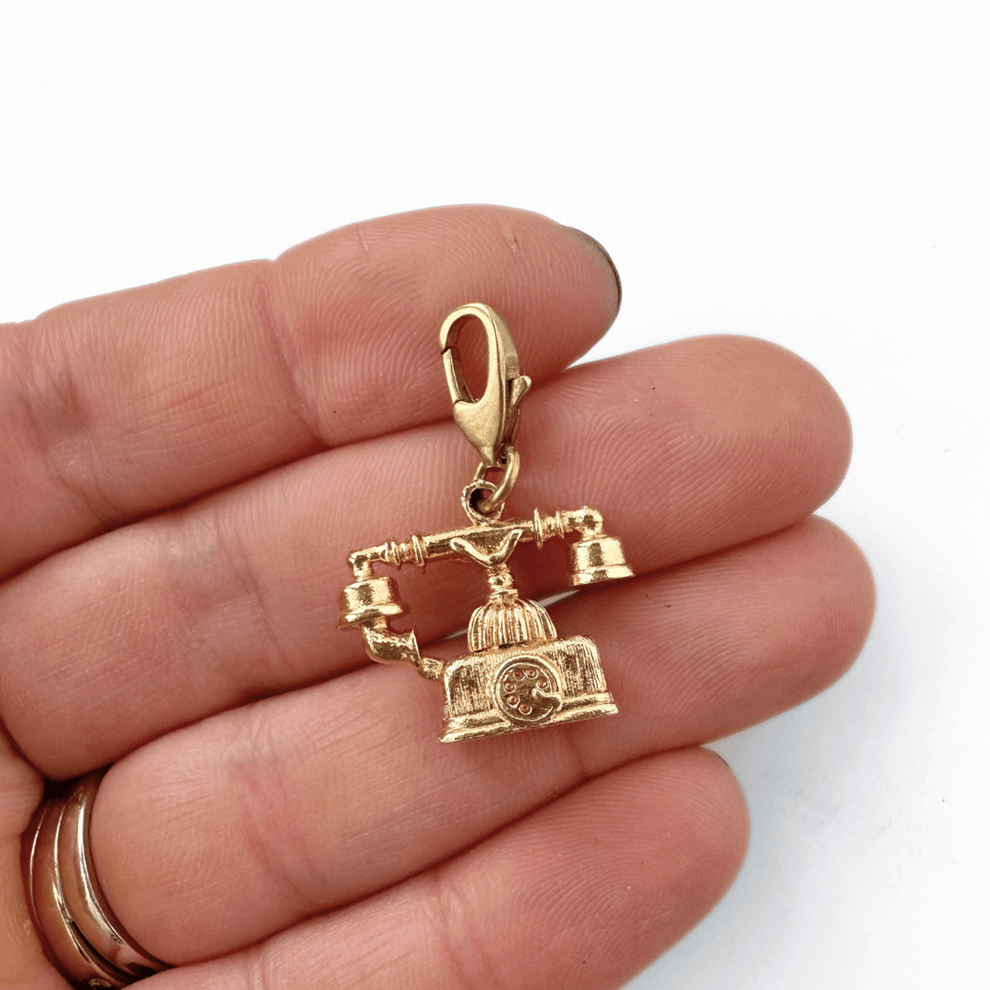 Small vintage gold rotary phone charm with raw brass lobster clasp