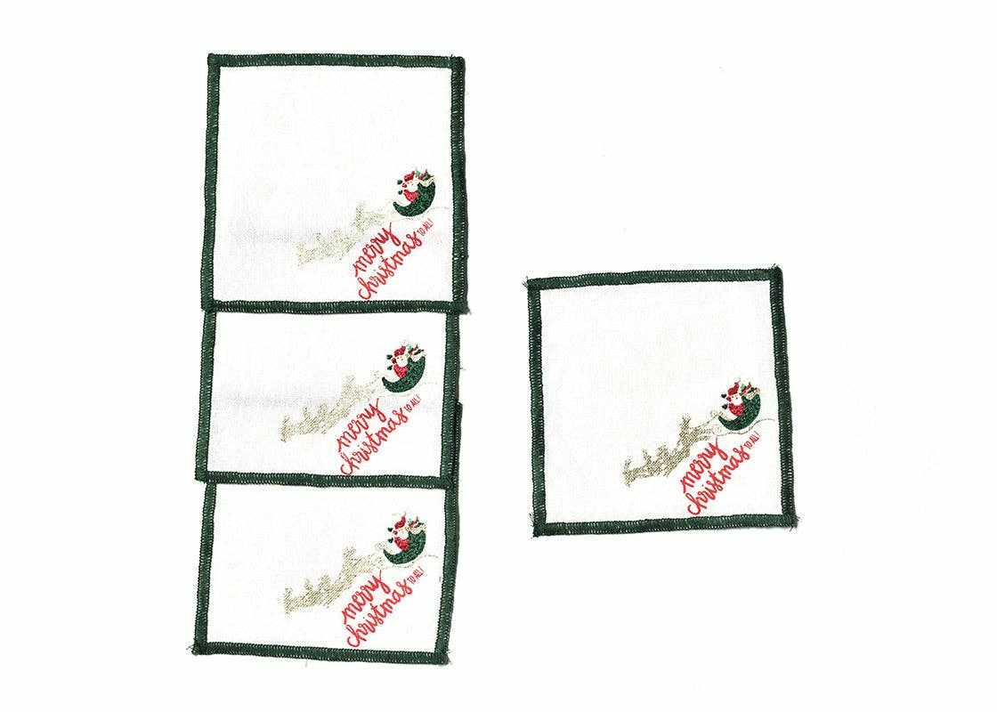 Set of 4 Flying Santa Cocktail Napkins with Christmas design and green border