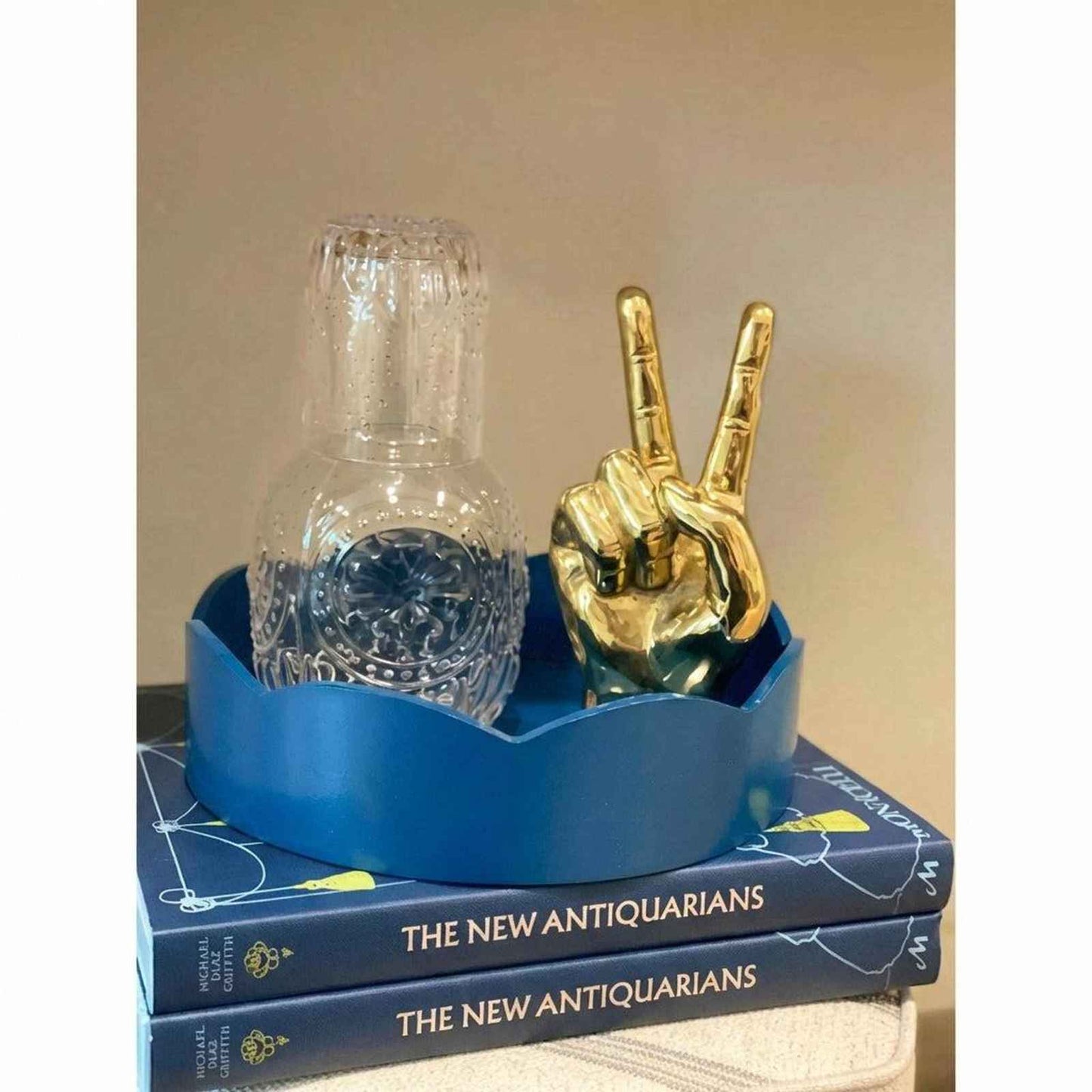 Embossed glass carafe and cup set with etched design for stylish beverage serving