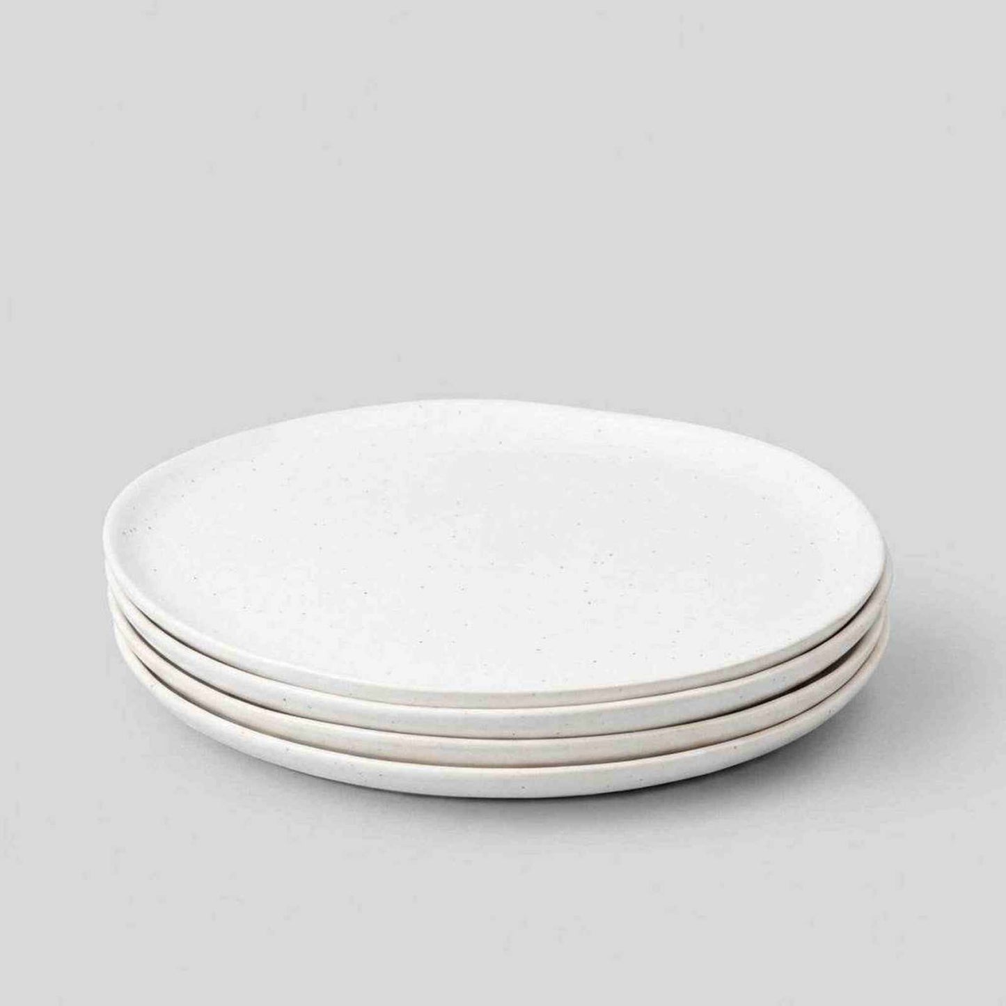 Set of 4 speckled white dinner plates hand-finished in Portugal with flat surface and low rim