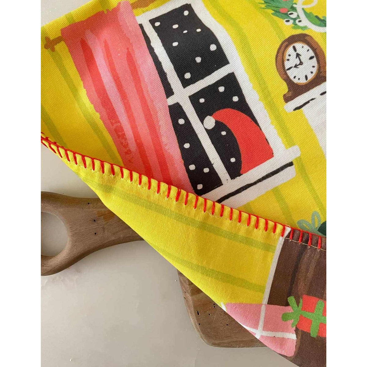 
                  
                    Colorful festive fireplace tea towel with embroidered trim and vivid holiday design
                  
                