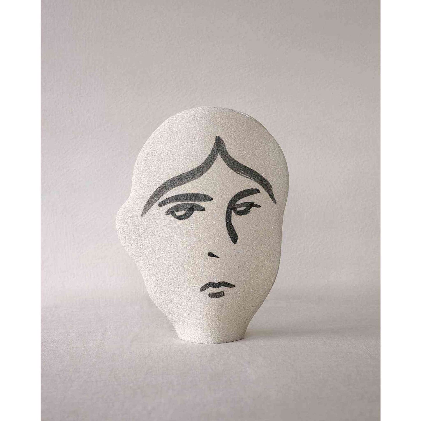 
                  
                    Handmade ceramic summer vase with abstract human face design and textured natural clay exterior
                  
                