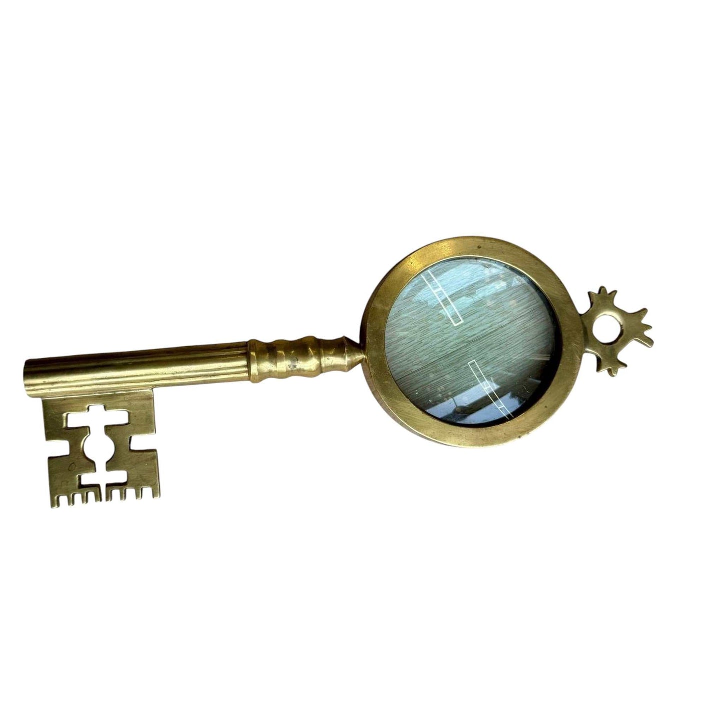 Vintage brass magnifying glass shaped like a key with solid brass vintage finish and functional design