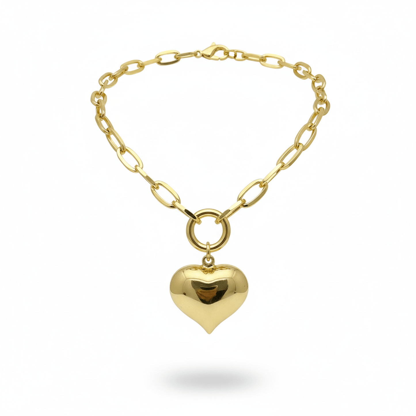 Chunky Bubble Heart Necklace gold filled chain with glossy bubble heart pendant displayed on pink velvet stand