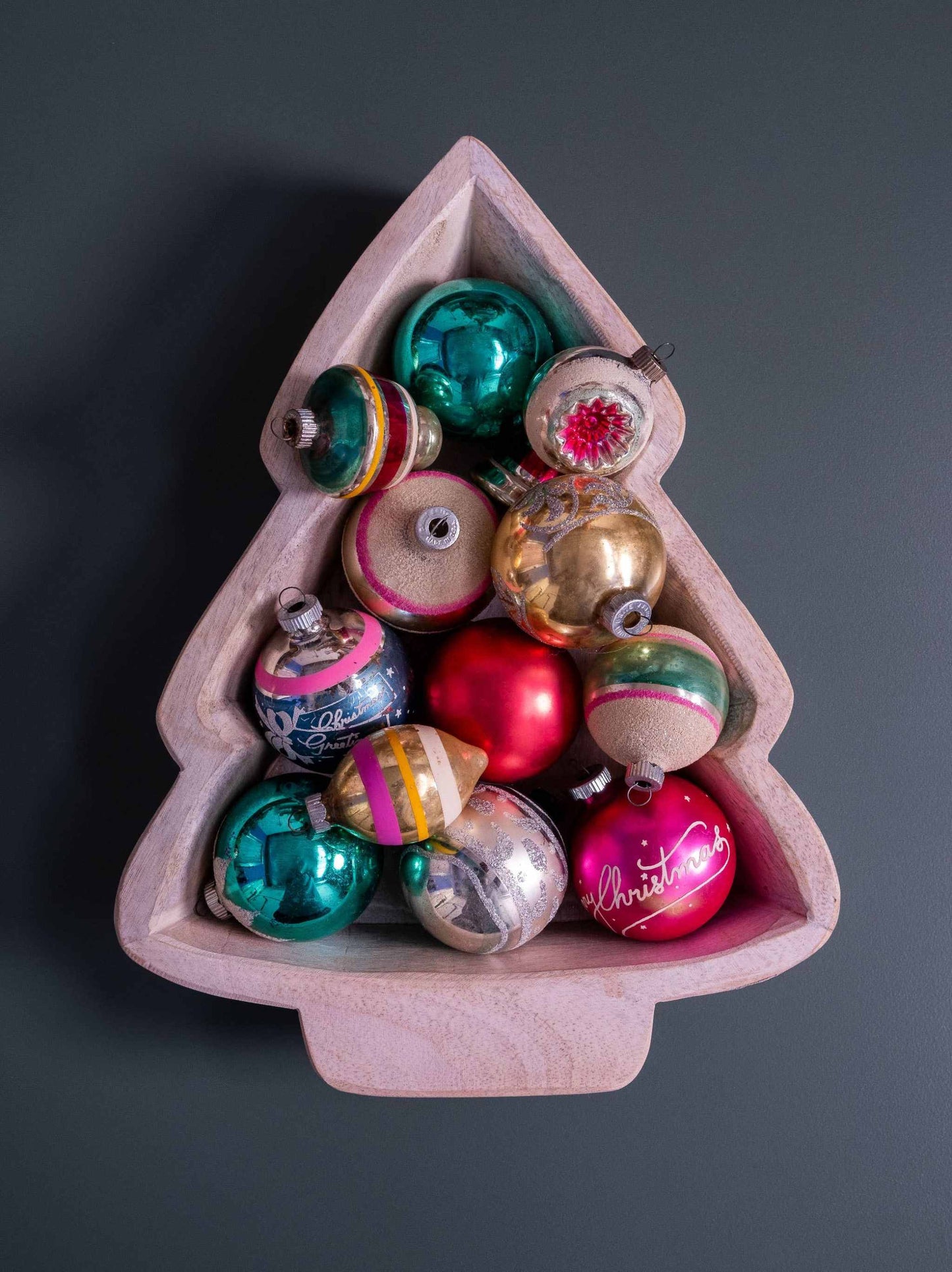 Small Christmas Tree Dough Bowl holding colorful vintage Christmas ornaments