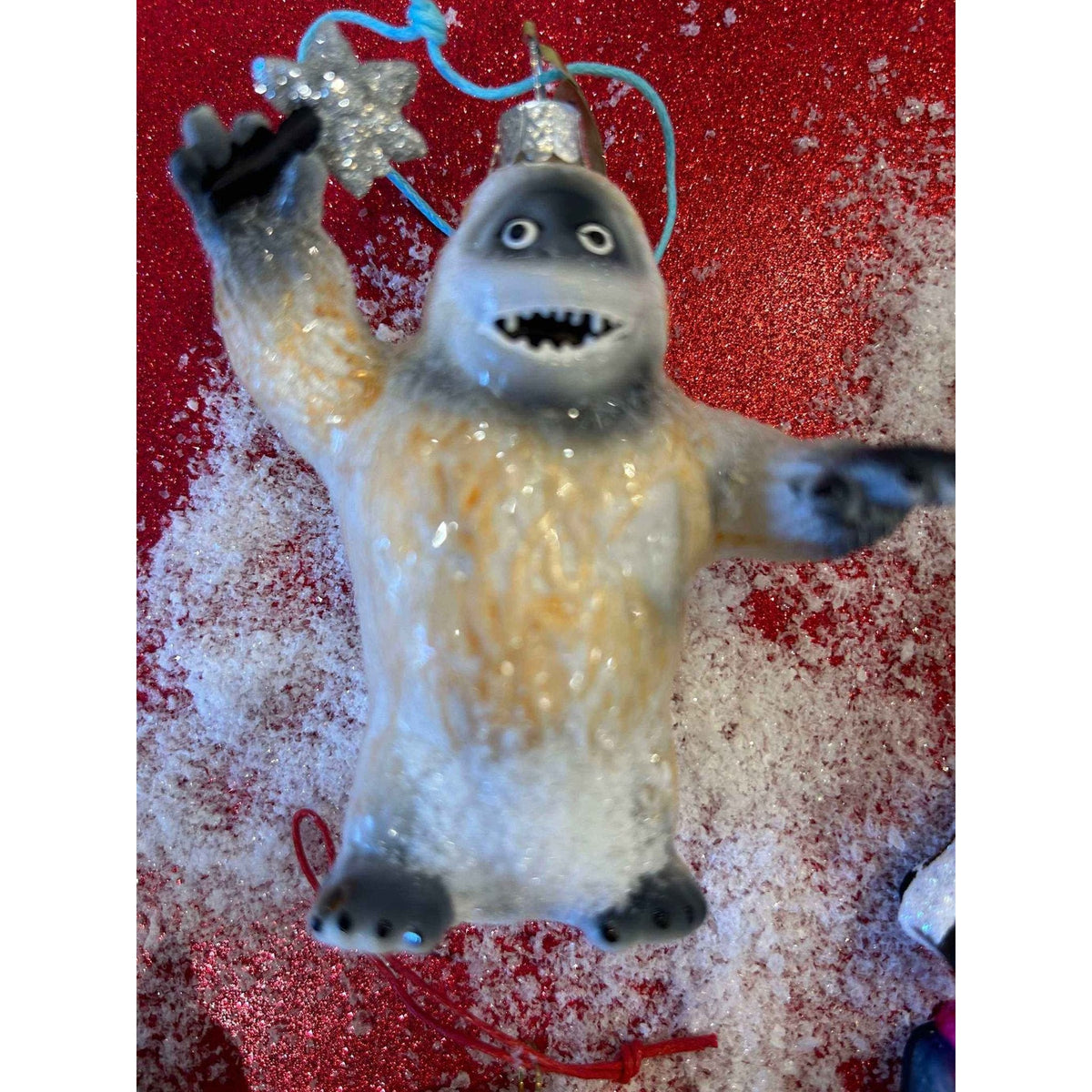 
                  
                    Vintage-style Retro Rudolph ornament featuring Hugo the Abominable Snowman with matte-glitter finish by Cody Foster & Co.
                  
                