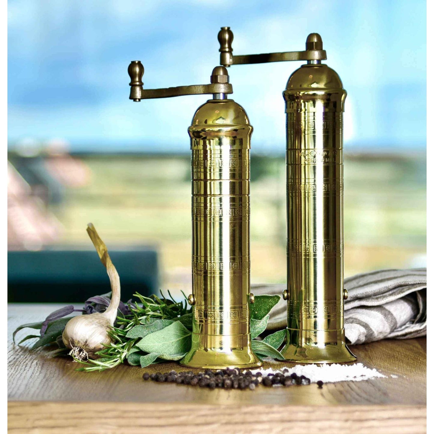 Handmade 8-inch Brass Mill salt grinder with crank and chiseled patterns for optimal salt grinding