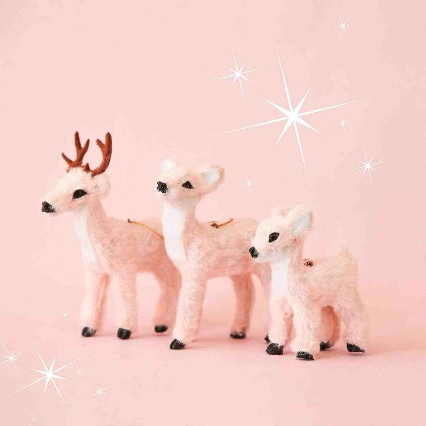 Set of peach fur reindeer ornaments in buck, doe, and fawn sizes for holiday decor