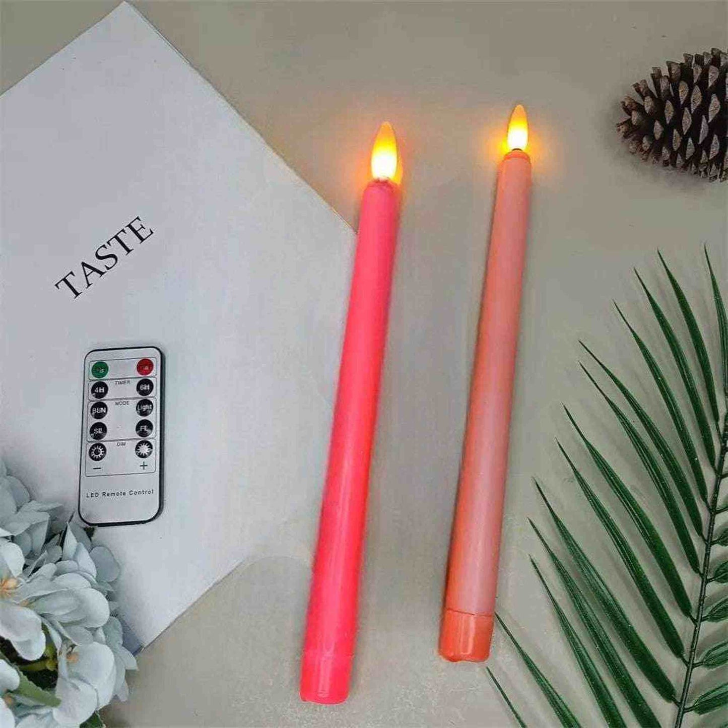 Set of 4 LED flameless taper candles in light and hot pink with remote control and flickering light effect