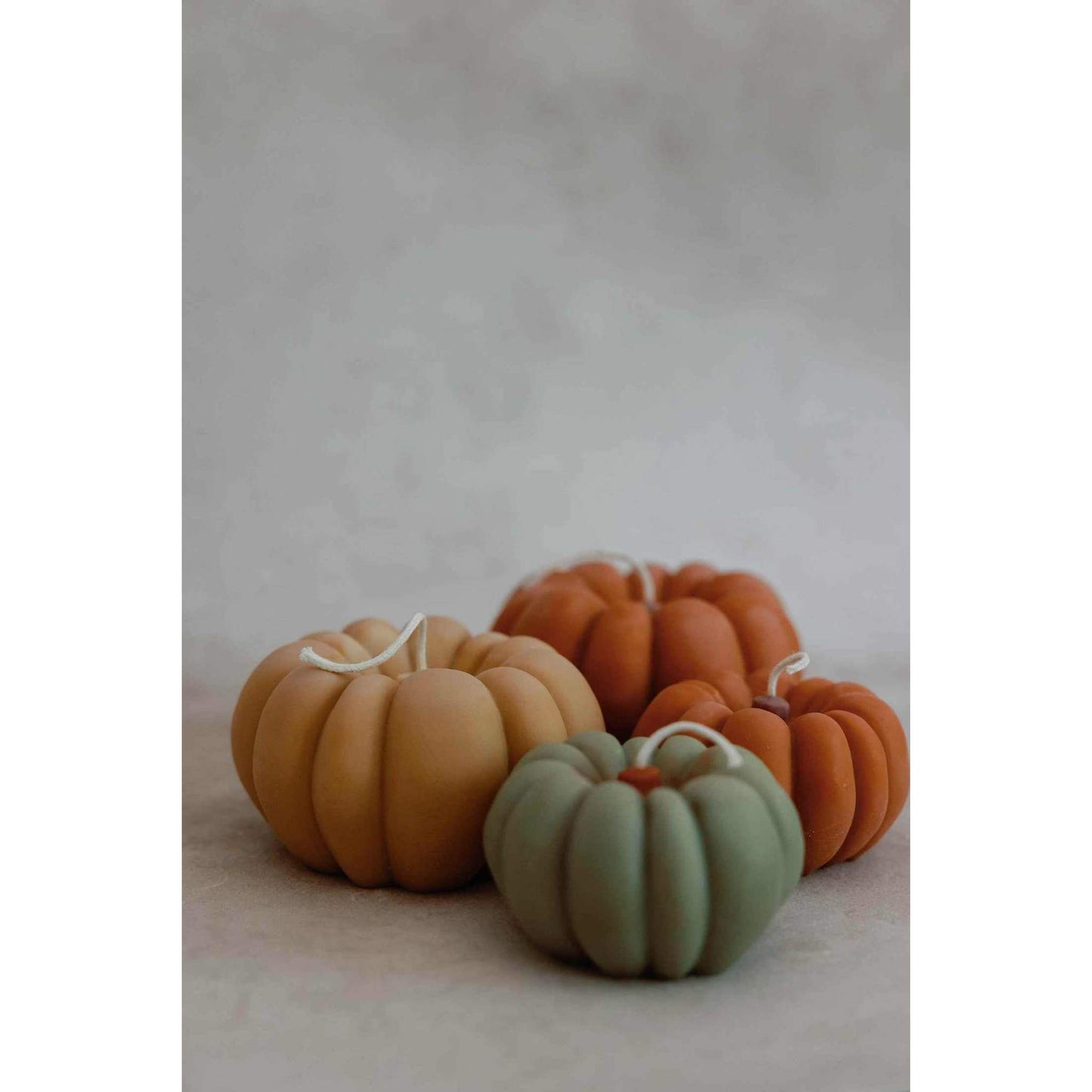 Terracotta color pumpkin shaped scented fall candles with apples and maple bourbon aroma