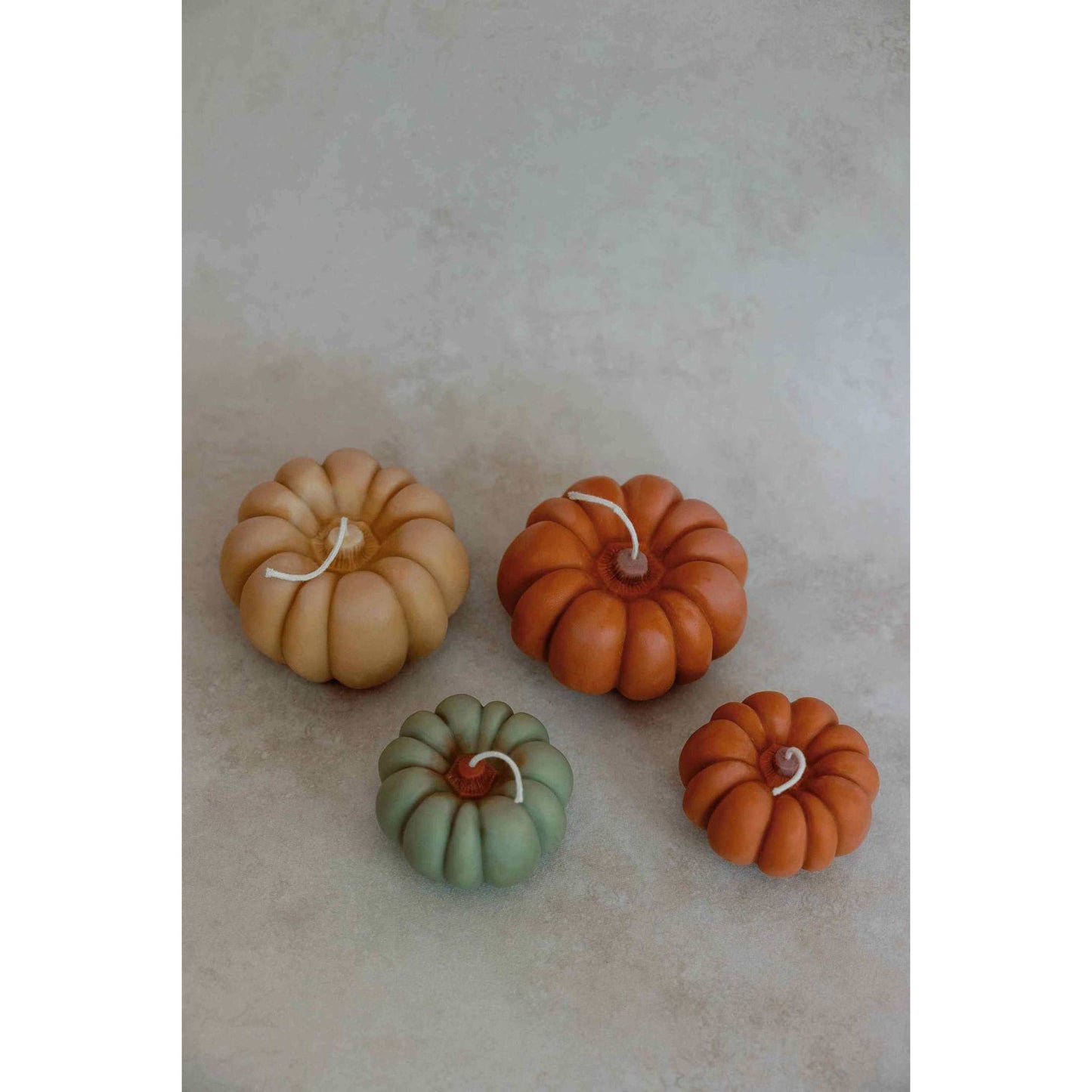 Terracotta color fall pumpkin candles with apples and maple bourbon scent in assorted sizes