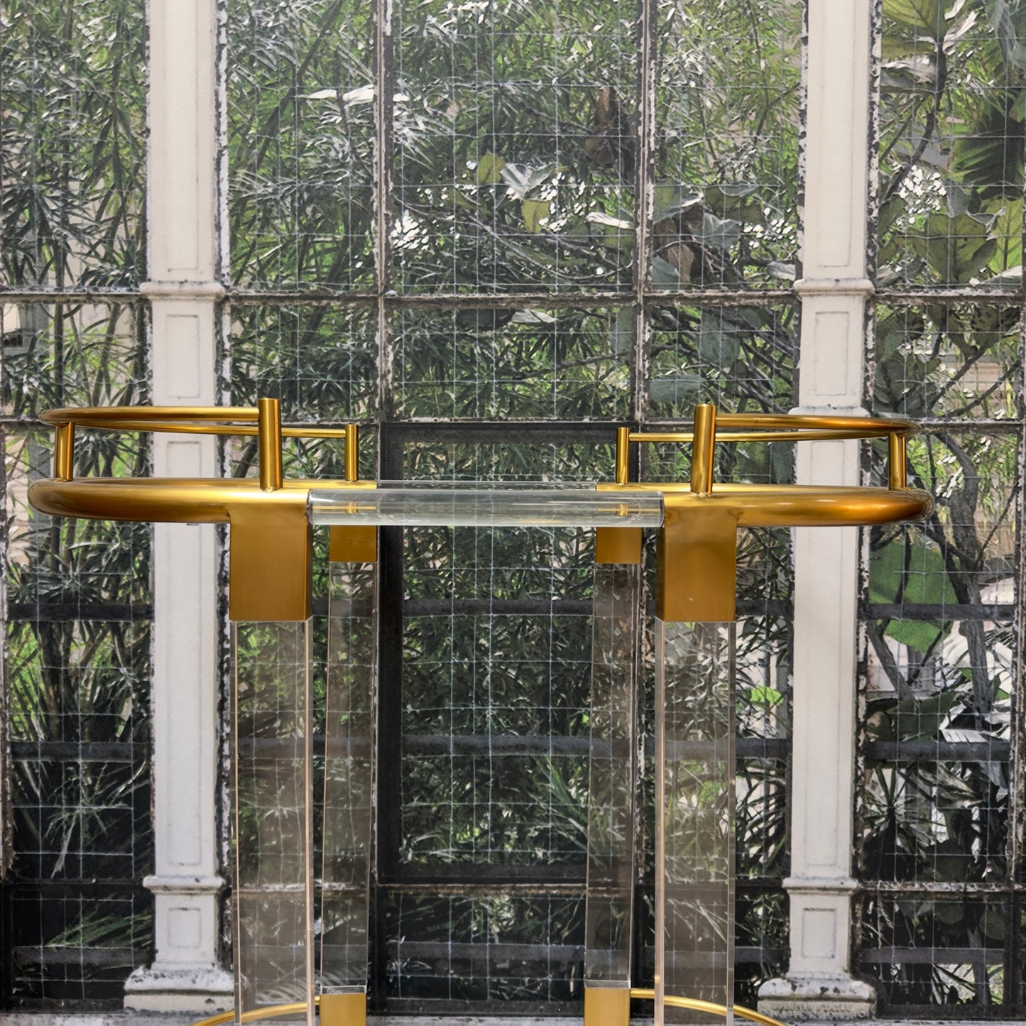 
                  
                    Close view of vintage brass oval rails and Lucite construction
                  
                
