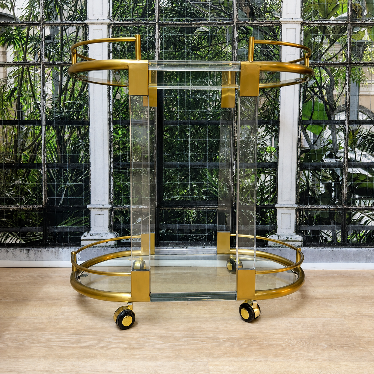 
                  
                    Vintage 1970s brass and Lucite oval rolling bar cart
                  
                