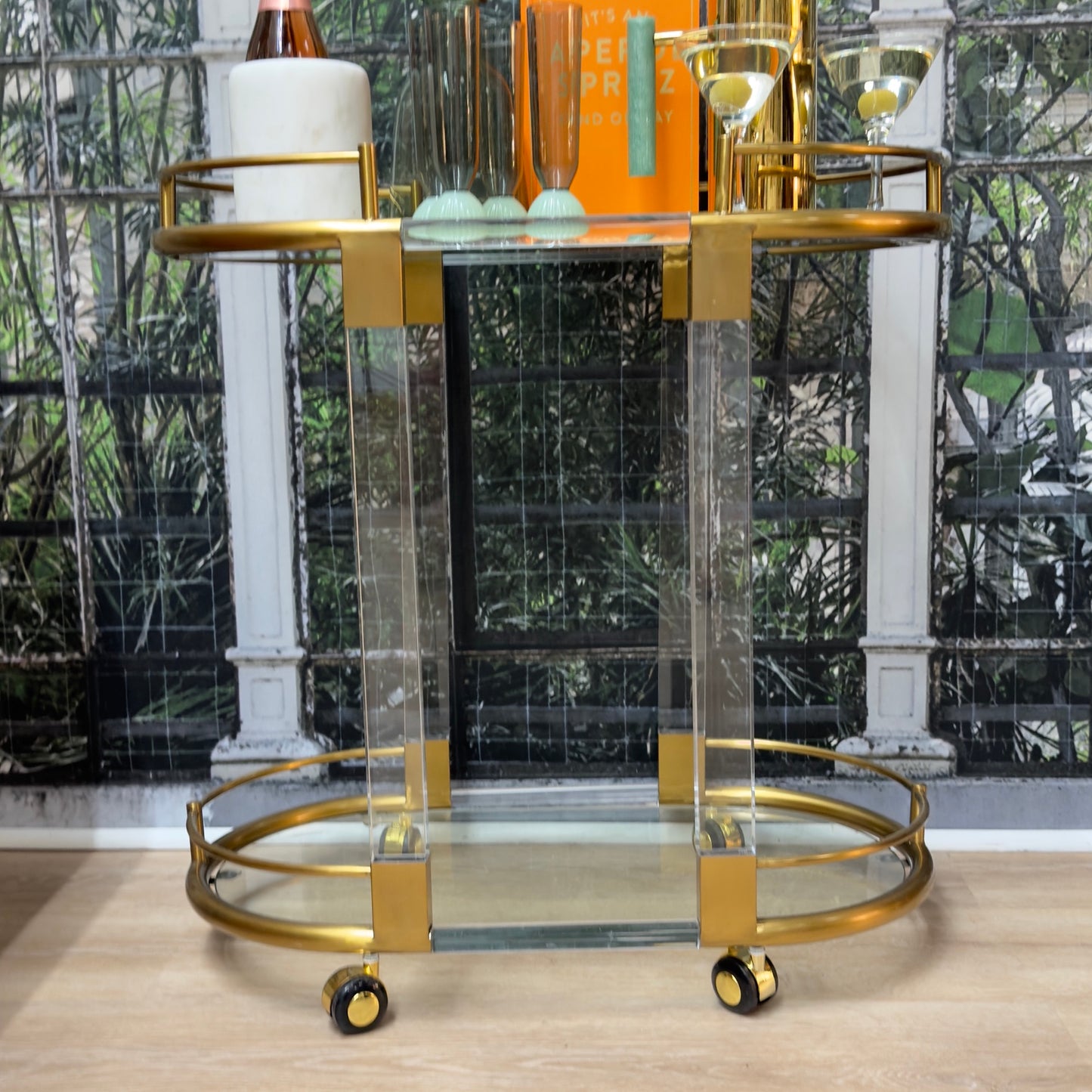 
                  
                    Vintage brass and Lucite bar cart styled with barware
                  
                