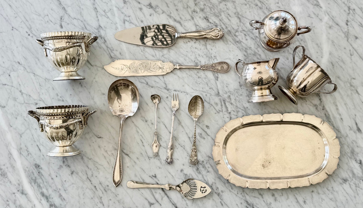 
                  
                    Vintage pierced silverplate serving spoon within a collected silver serving assortment
                  
                