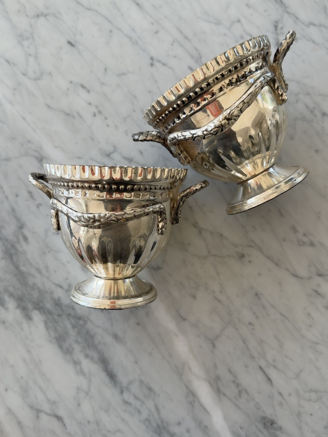 
                  
                    Pair of vintage silverplate urn-form cachepots
                  
                