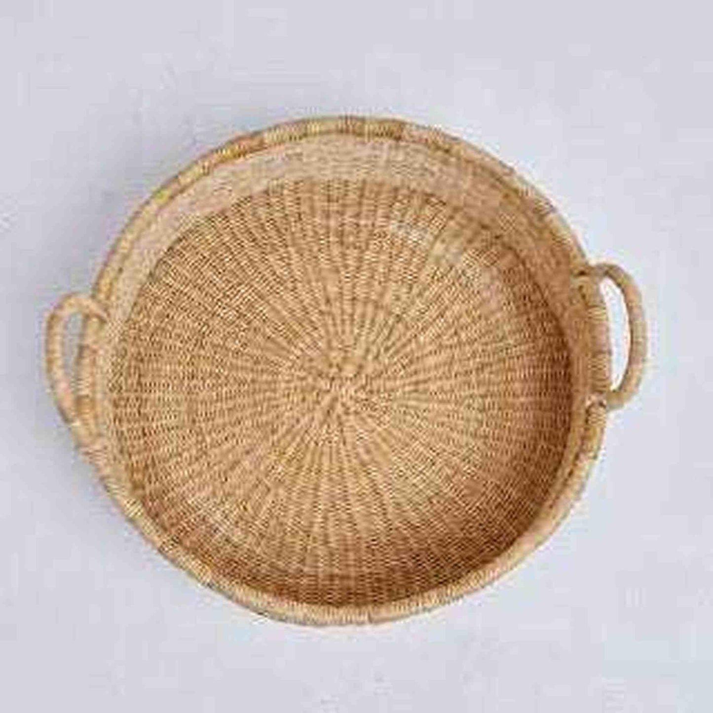 Handcrafted Bolga woven tray round with handles made from dried elephant grass, lightweight and durable.